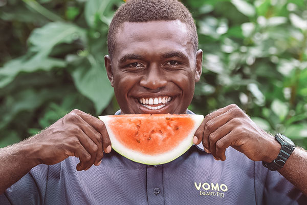 Pax eating watermelon on vomo island fiji