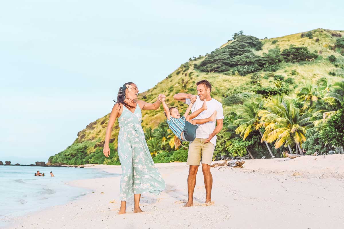 Family enjoying the luxury of time together on vomo island fiji beach