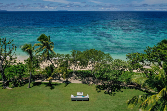 Taleitaki Residence - Lounges on Lawn - Aerial View showing proximity to oceanfront - Luxury Fiji Accommodation - Vomo Island Fiji